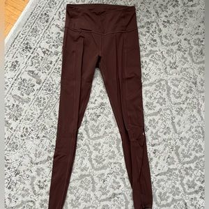 Brown Lululemon leggings with side pockets, size 6 never worn.